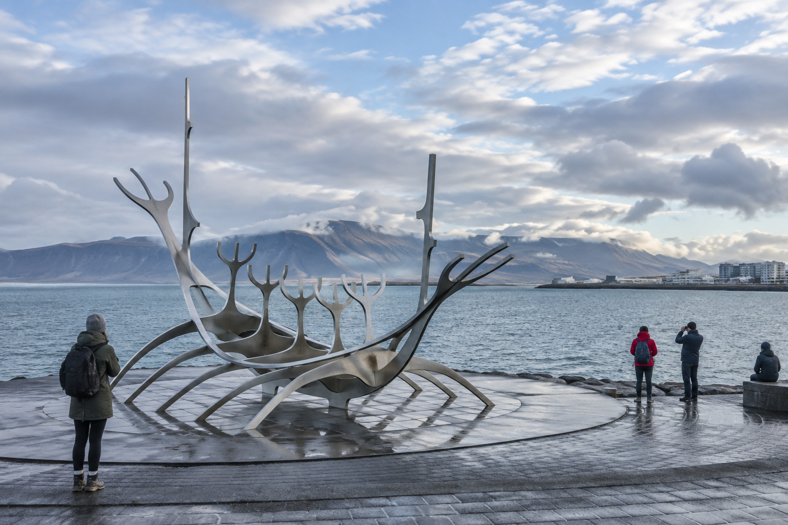 Sun Voyager sculpture on Reykjavík’s waterfront beneath a cloudy autumn sky.